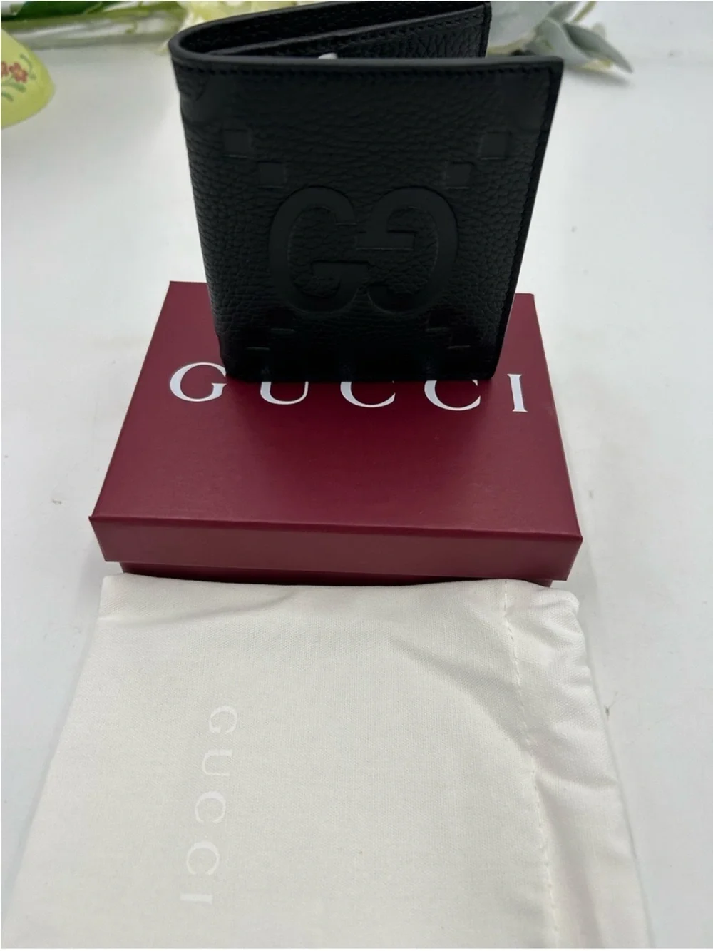 Men’s Gucci, jumbo GG leather bifold wallet made in Italy